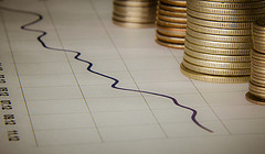 Investment-Earnings - Graph With Stacks Of Coins Investment-Earnings